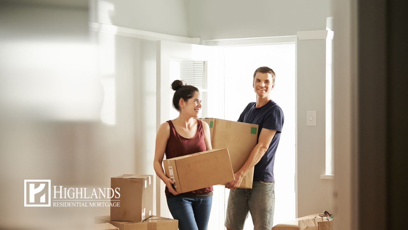 Young couple moving into new home using first-time home buyer programs in 2026