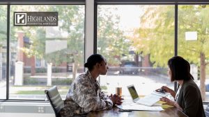 VA loan benefits in 2026 - active duty military service member meeting with mortgage lender